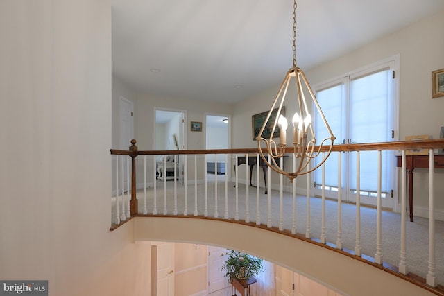 interior details featuring a notable chandelier