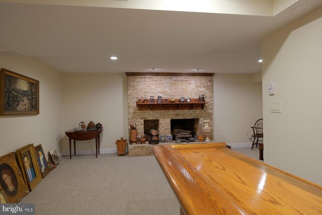 carpeted living room with a brick fireplace