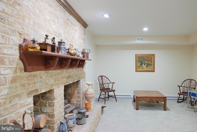 sitting room featuring carpet flooring and a fireplace