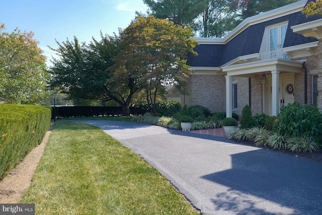 view of property exterior featuring a yard