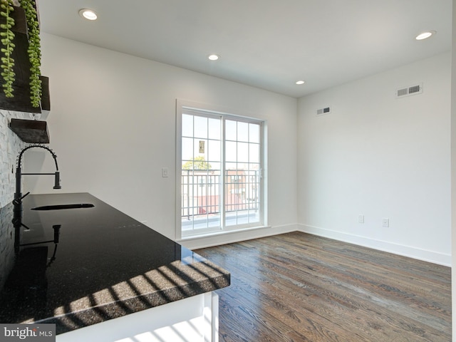 interior space with dark hardwood / wood-style floors and sink