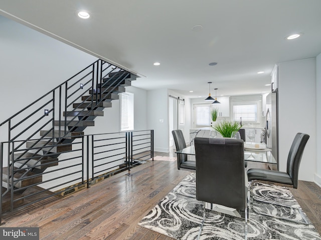 dining space featuring dark hardwood / wood-style floors