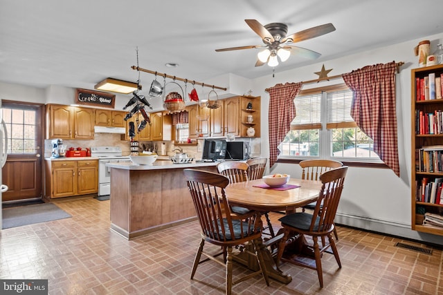 dining room featuring ceiling fan