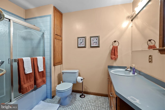 full bathroom featuring shower / bath combination with glass door, vanity, toilet, and tile patterned floors