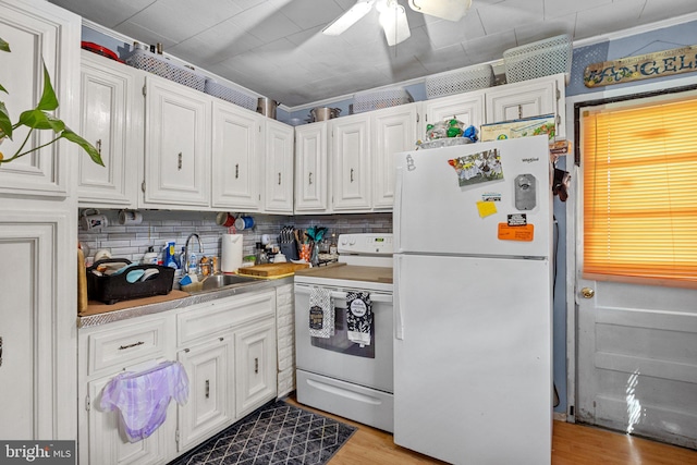 kitchen with sink, white cabinets, backsplash, white appliances, and ceiling fan