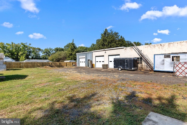 exterior space with a lawn and a garage