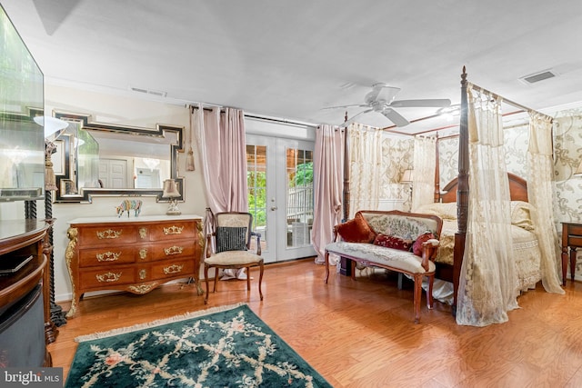 bedroom featuring light hardwood / wood-style flooring, french doors, and access to exterior