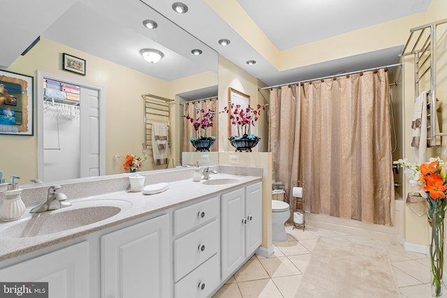 full bathroom featuring tile patterned flooring, vanity, toilet, and shower / bath combo with shower curtain