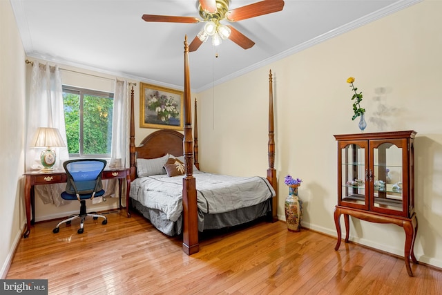 bedroom with ceiling fan, light hardwood / wood-style flooring, and crown molding