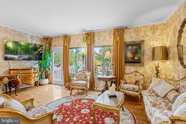 living room featuring hardwood / wood-style flooring and ornamental molding