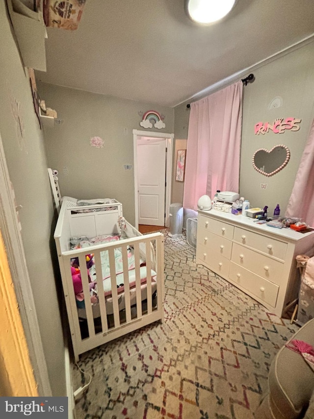 bedroom with a nursery area