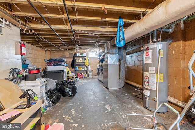 basement with gas water heater and washer / clothes dryer