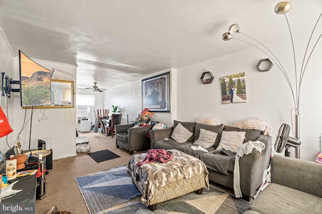 carpeted living room with ceiling fan