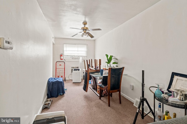 interior space with carpet floors and ceiling fan