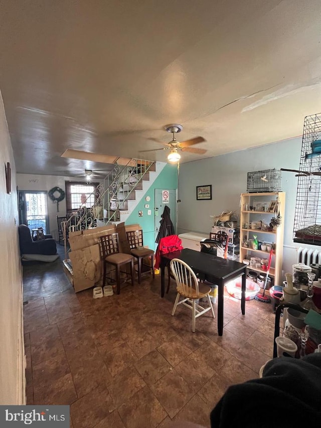 dining space featuring ceiling fan