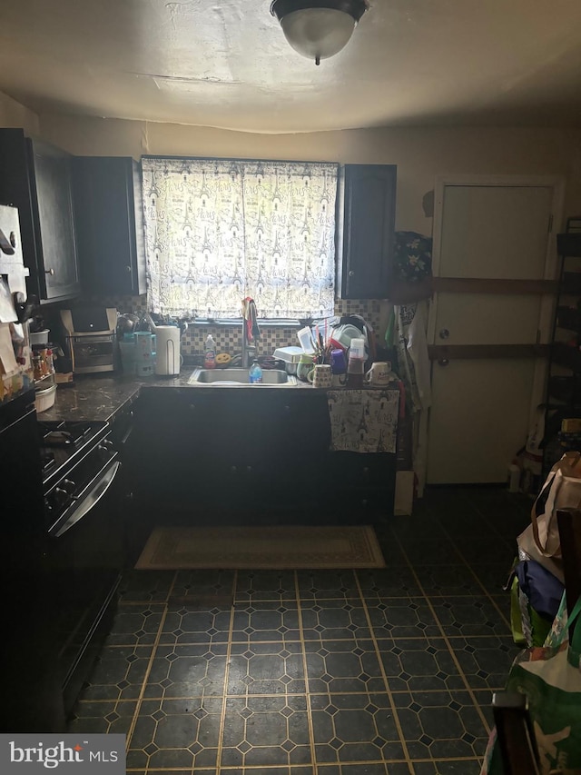 kitchen featuring black electric range and sink