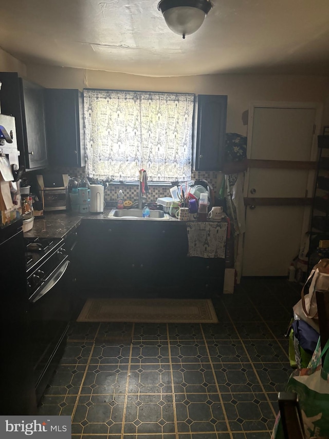 kitchen with black electric range and sink