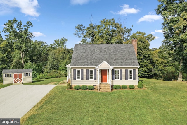 new england style home with a storage unit and a front lawn