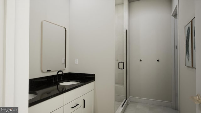 bathroom featuring vanity and an enclosed shower