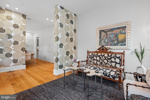 living area with hardwood / wood-style flooring