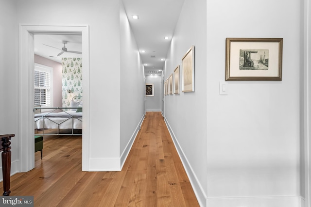 corridor featuring hardwood / wood-style flooring