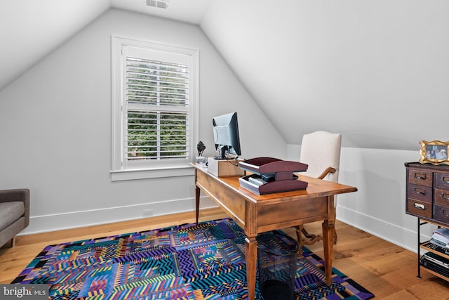 office area with lofted ceiling and hardwood / wood-style flooring