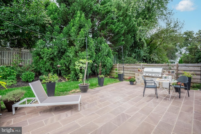 view of patio with a grill