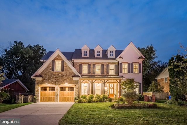 view of front facade with a front yard and a garage