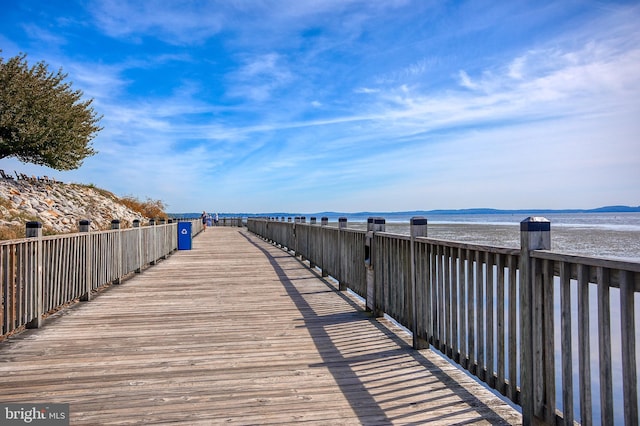 surrounding community with a water view