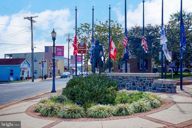 exterior space with sidewalks, curbs, and street lights