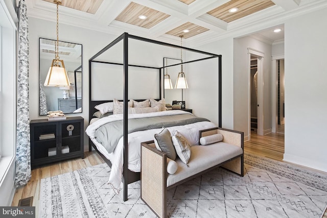bedroom featuring wood finished floors, beamed ceiling, ornamental molding, coffered ceiling, and recessed lighting