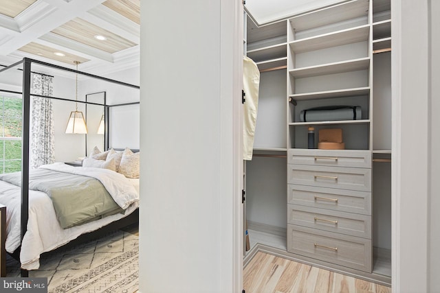 bedroom featuring recessed lighting, beamed ceiling, wood finished floors, and coffered ceiling