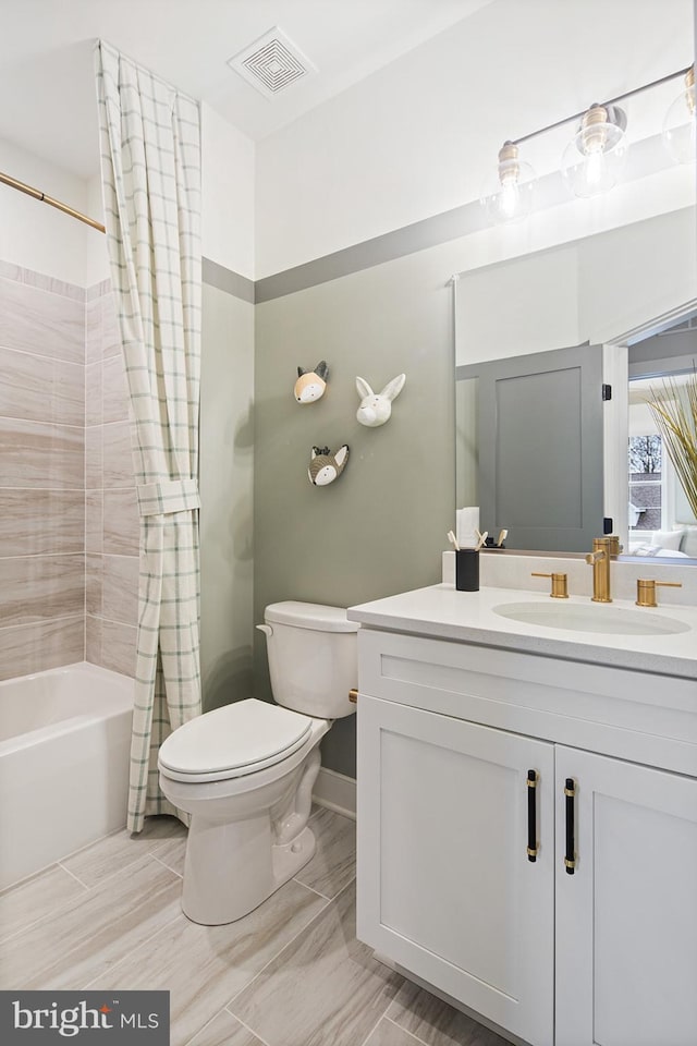 bathroom featuring vanity, shower / tub combo with curtain, toilet, and visible vents