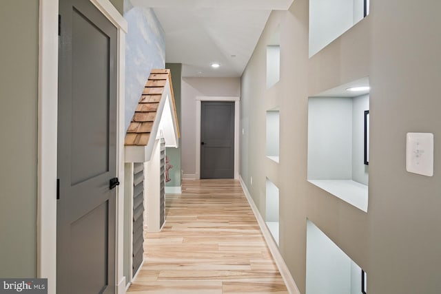 hall with recessed lighting, baseboards, and light wood finished floors