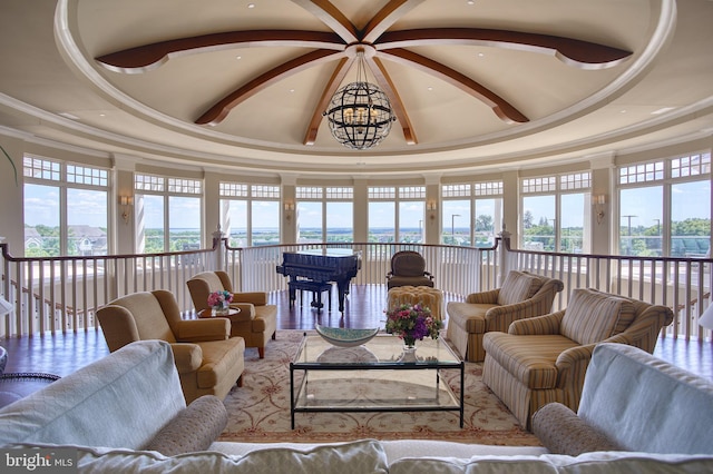 living room featuring vaulted ceiling with beams, crown molding, and a wealth of natural light