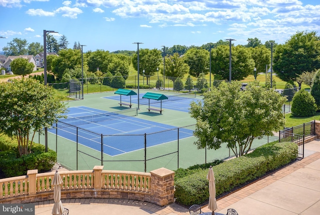 view of tennis court with fence