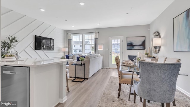 dining space with light hardwood / wood-style floors