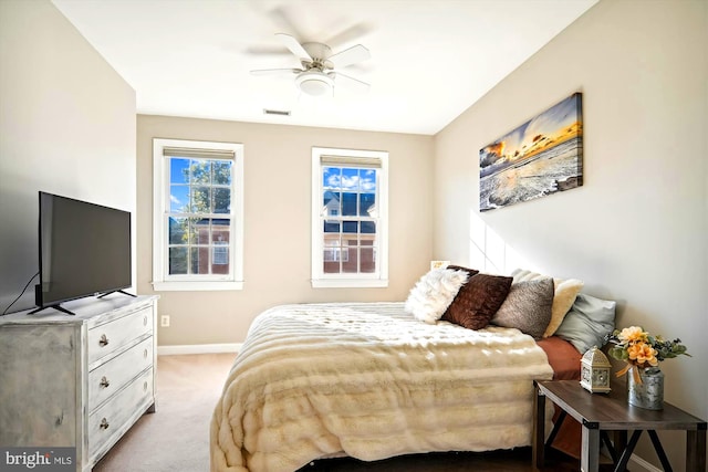 bedroom with light carpet and ceiling fan