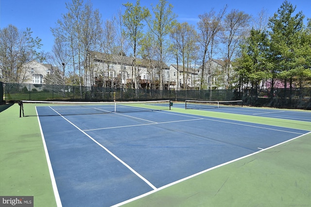 view of tennis court featuring basketball court