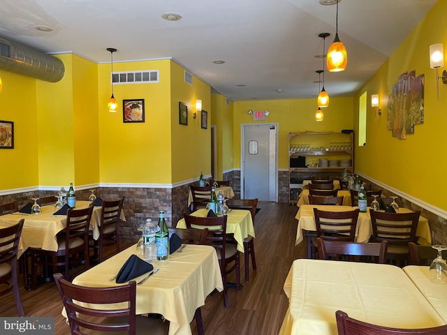 dining space featuring dark hardwood / wood-style flooring