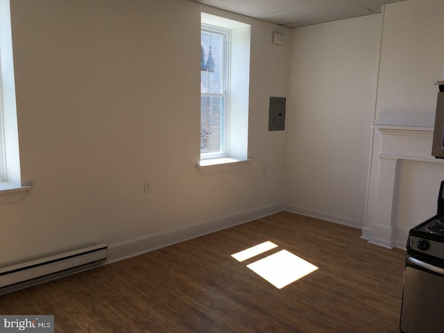 unfurnished living room featuring a baseboard radiator, electric panel, a paneled ceiling, and dark hardwood / wood-style flooring