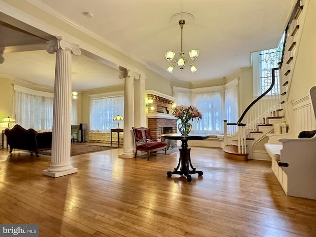 misc room with hardwood / wood-style floors, plenty of natural light, and a fireplace