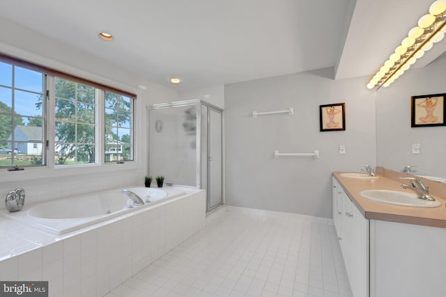 bathroom featuring vanity, separate shower and tub, and tile patterned floors