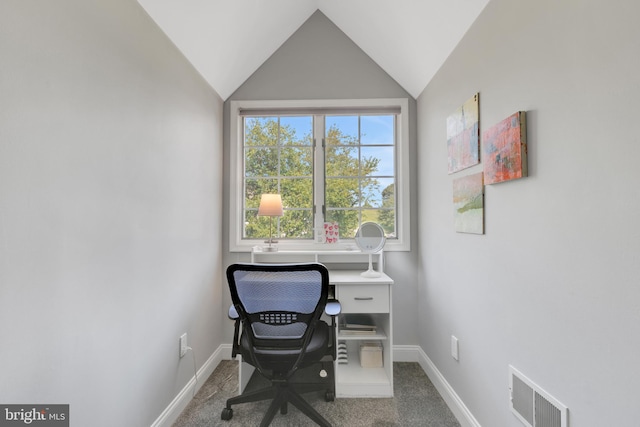 home office with carpet flooring and vaulted ceiling