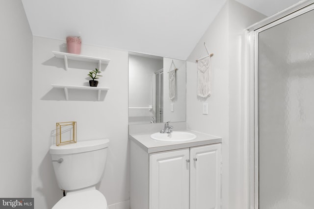 bathroom with walk in shower, vanity, and toilet