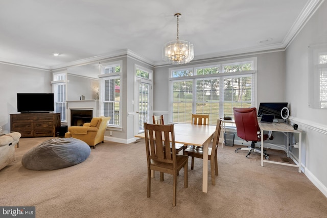 carpeted dining area featuring crown molding and a chandelier