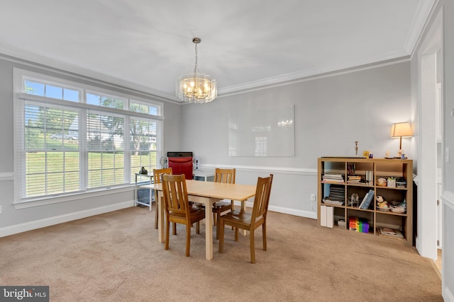 dining room featuring ornamental molding, a notable chandelier, and light colored carpet