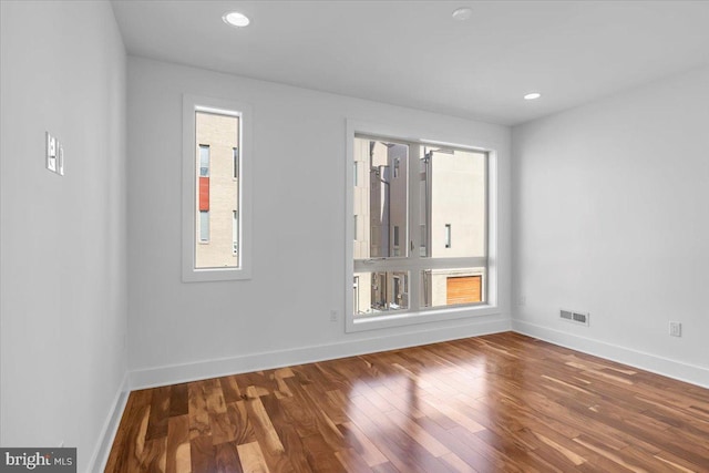 empty room with wood-type flooring