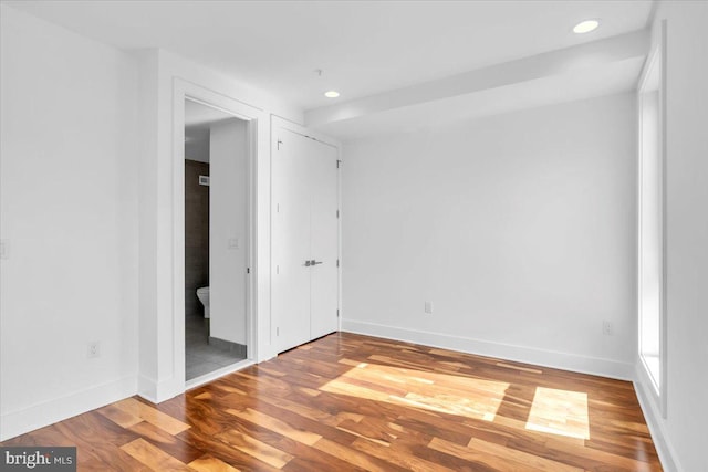 spare room featuring hardwood / wood-style floors