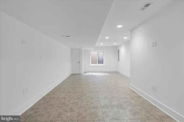 empty room featuring light tile patterned floors